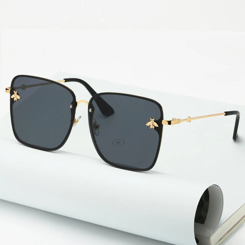 Stijlvolle dames oversized randloze zonnebril met trendy gradient glazen en UV400 bescherming.