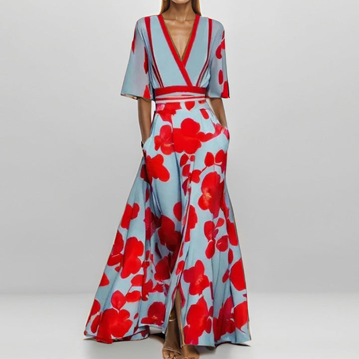 Lange dames zomerjurk CJ26 met verfijnde bloemenprint en korte mouwen, perfect voor een elegante zomerlook.