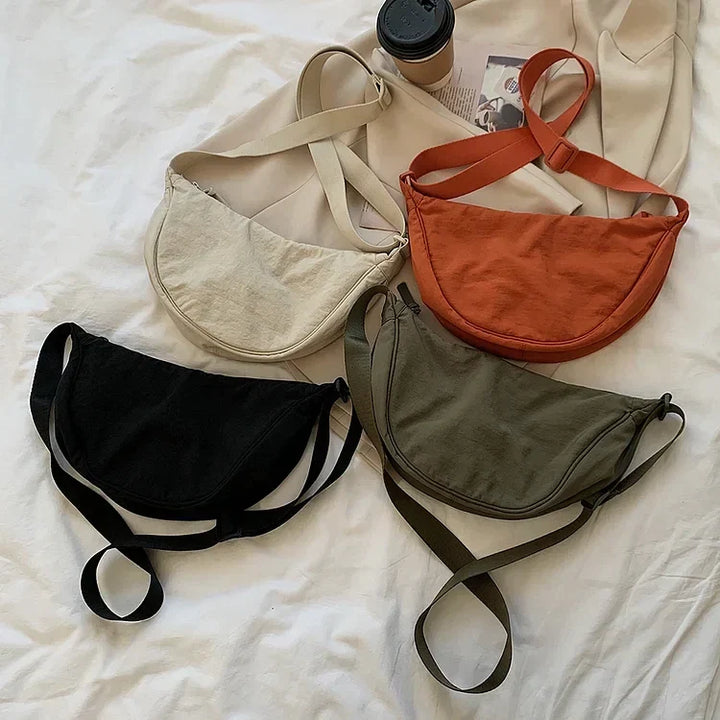 Trendy dagelijkse tas: een lichtgewicht dumpling crossbody, comfortabel voor de hele dag.