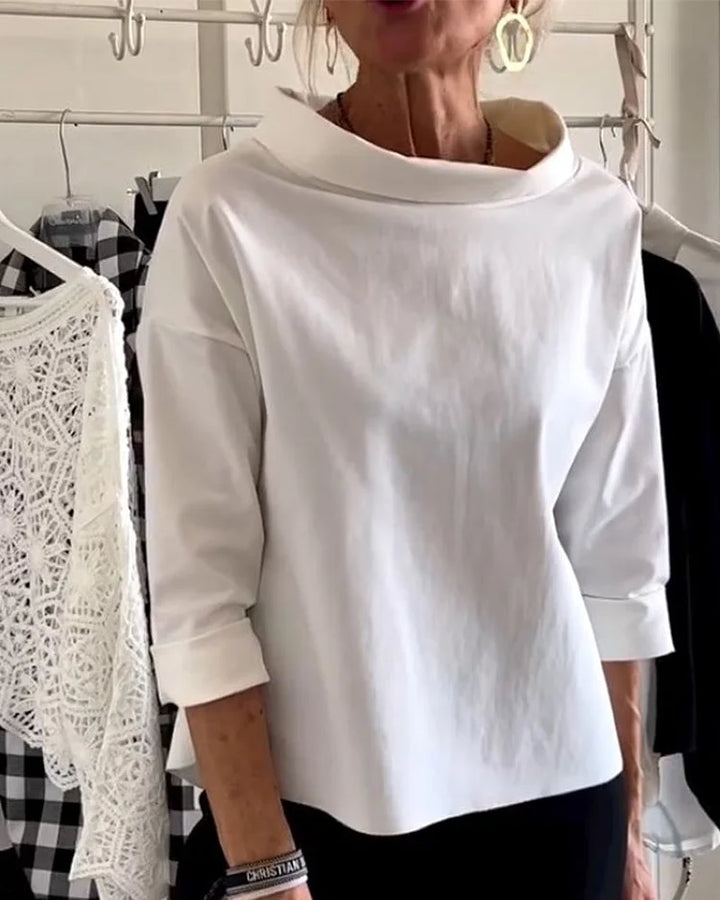 Dames casual top met stijlvolle revers, halve col en losvallende pasvorm. Ideaal voor lente/zomer damesmode.