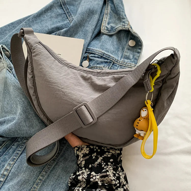 Trendy canvas dumpling schoudertas, in een unieke dumpling vorm, een must-have voor dames.
