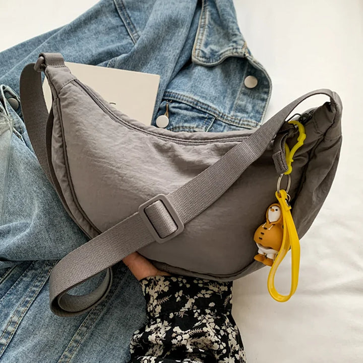 Trendy canvas dumpling schoudertas, in een unieke dumpling vorm, een must-have voor dames.