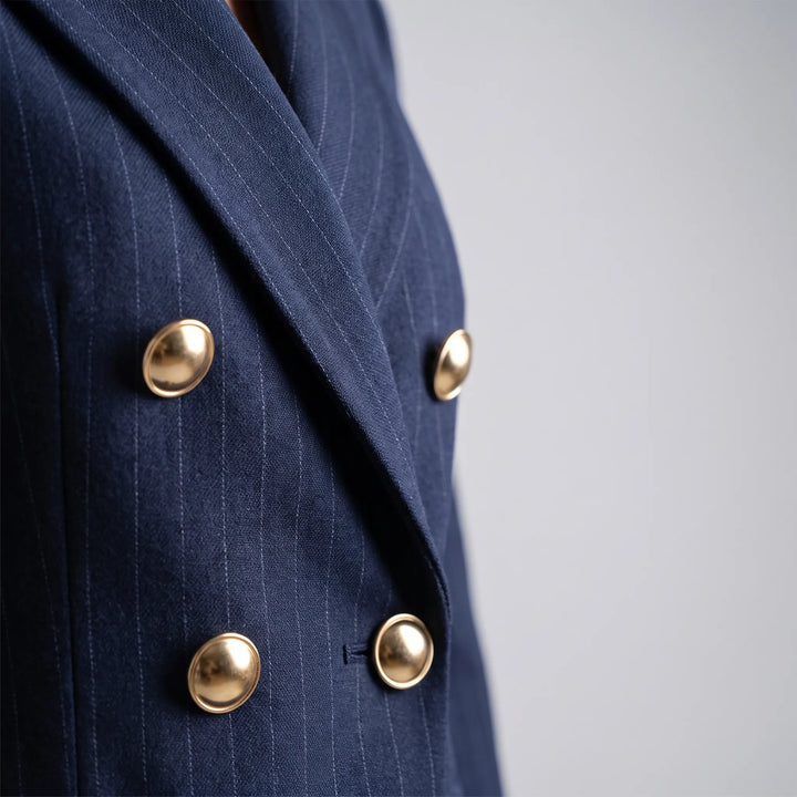 Gestreept dames broekpak, 2-delig met wijde pijpen pantalon en bijpassende blazer. Comfortabel & elegant.