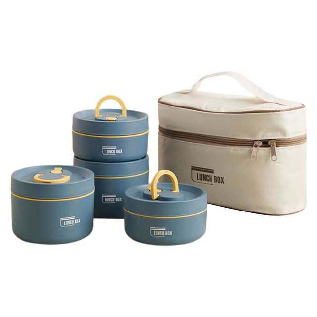 Verse salade en warme soep in de Isobox™ lunchbox, gescheiden door de handige lagen.