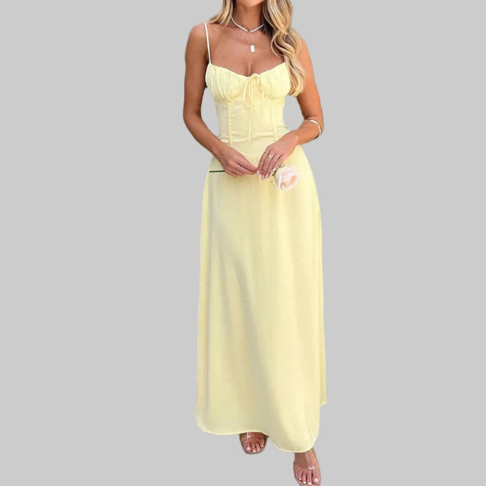 Modieuze witte/gele/donkerblauwe A-lijn jurk met open rug en vetersluiting, perfect als casual strandjurk.