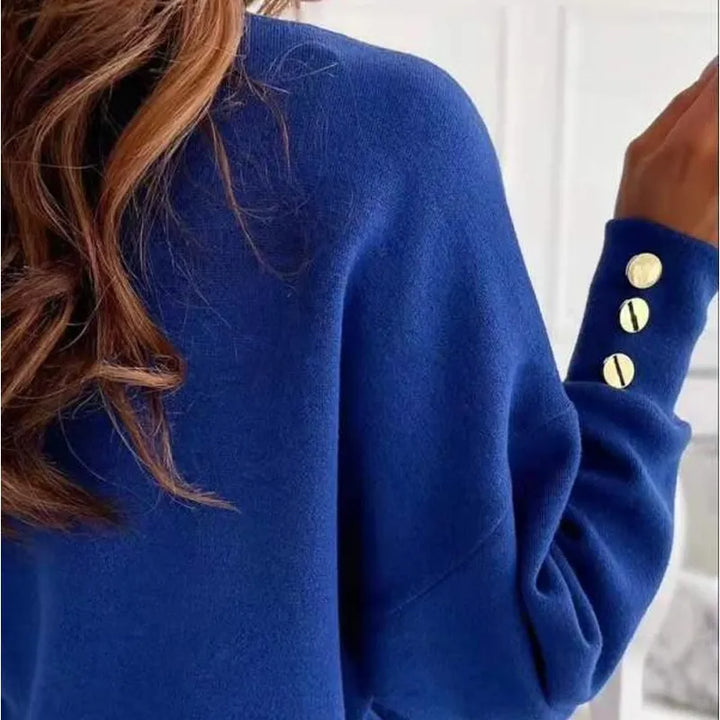 Dames trui met diepe V-hals. Zachte katoen mix, perfect voor elegante en comfortabele winter outfits.