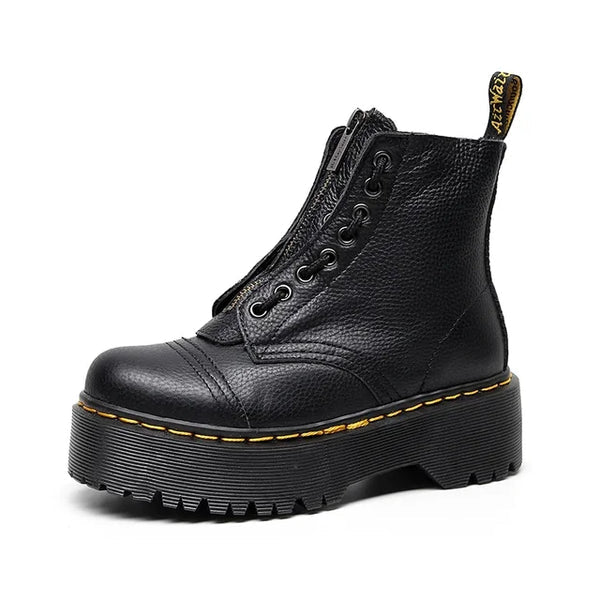 Comfortabele zwarte chelsea laarzen van leer met robuuste dikke zool. Trendy dames enkellaarzen voor elke dag.