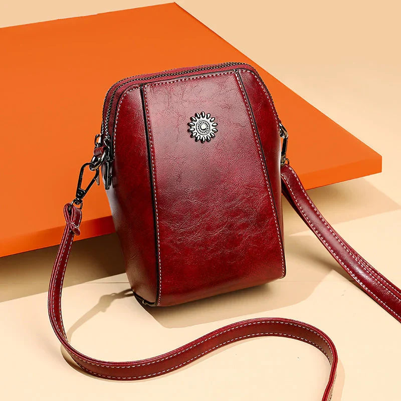 Praktische Charina schoudertas voor dames met veilige ritssluiting. Stijlvol kunstleren mode accessoire met verstelbare band.