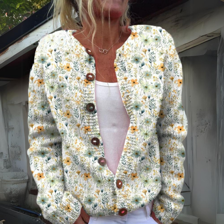 Stijlvolle dames cardigan met levendige bloemenprint, knoopsluiting en comfortabele pasvorm.
