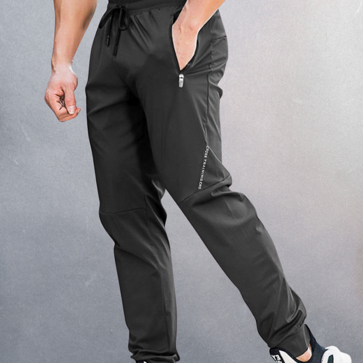 Heren trainingsbroek met elastische tailleband, ademend materiaal, perfect voor sport en casual draagcomfort.