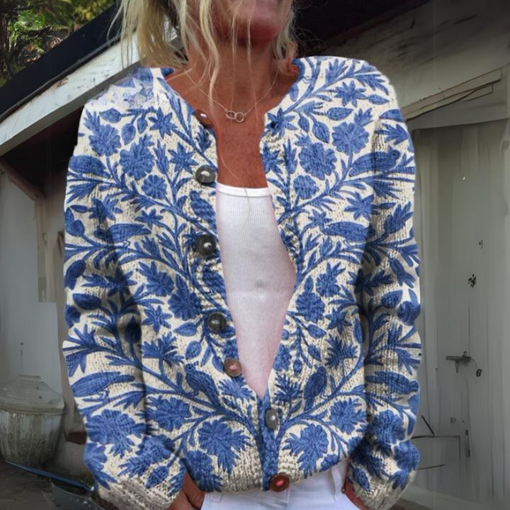 Modieuze dames vest met opvallende gebloemde print en elegante knoopdetails, perfect voor lente/zomer.