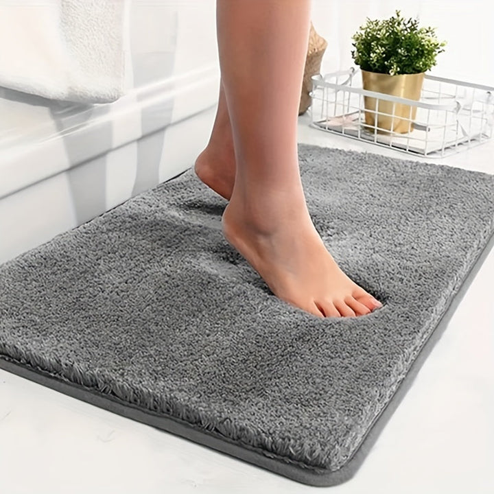 Ultrazachte absorberende badmat van polyester, comfortabel pluizig en sneldrogend voor badkamer.
