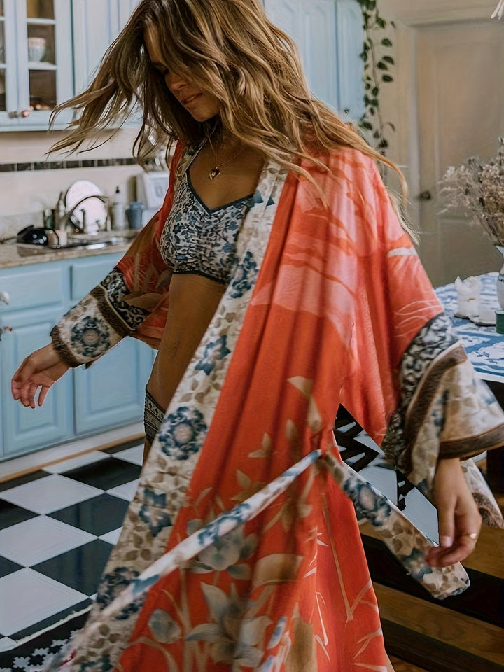 Casual chic dames kimono met rood-oranje bloemenprint. Lichtgewicht voor warme zomerdagen.
