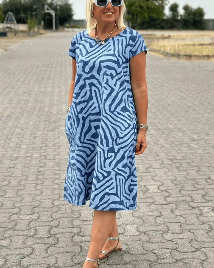 Groene dames zomerjurk met levendige print, elegant en comfortabel voor elke gelegenheid.