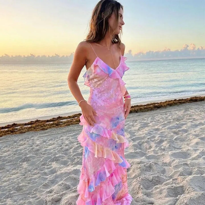 Liora dames zomerjurk met vrolijke ruches in levendige roze en gele kleuren; perfect voor casual vakantiedagen.