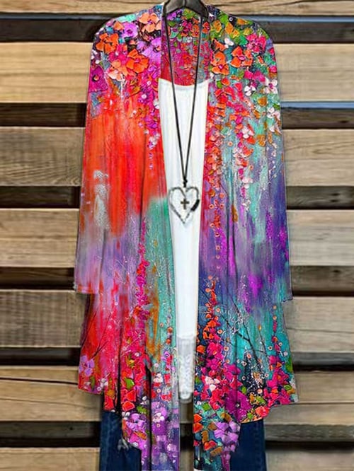 Modieus lang dames vest met levendige bloemenprint. Losvallend model voor een elegante en comfortabele look, ideaal voor vrouwen.