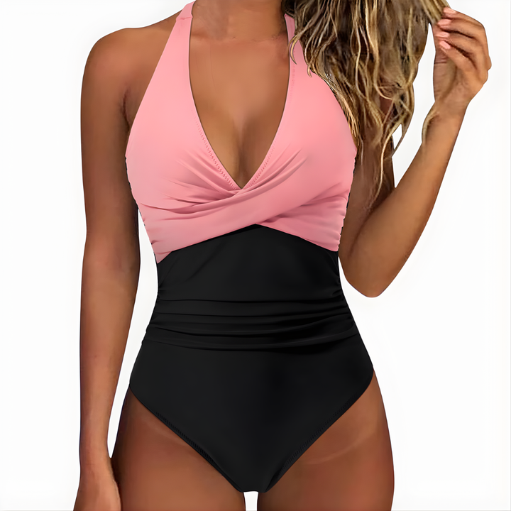 Dames badpak, geplooid en comfortabel, perfect voor ontspanning aan het water.