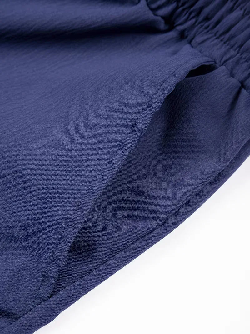Witte plissé shorts voor heren, losse pasvorm en ademend voor hete zomerdagen.