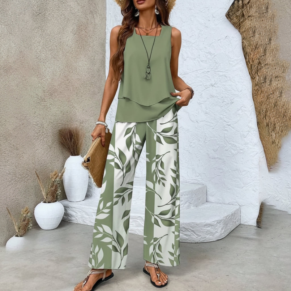 Elegante tweedelige zomer set voor dames: modieuze gelaagde top en wijde broek, perfect voor vakantie.