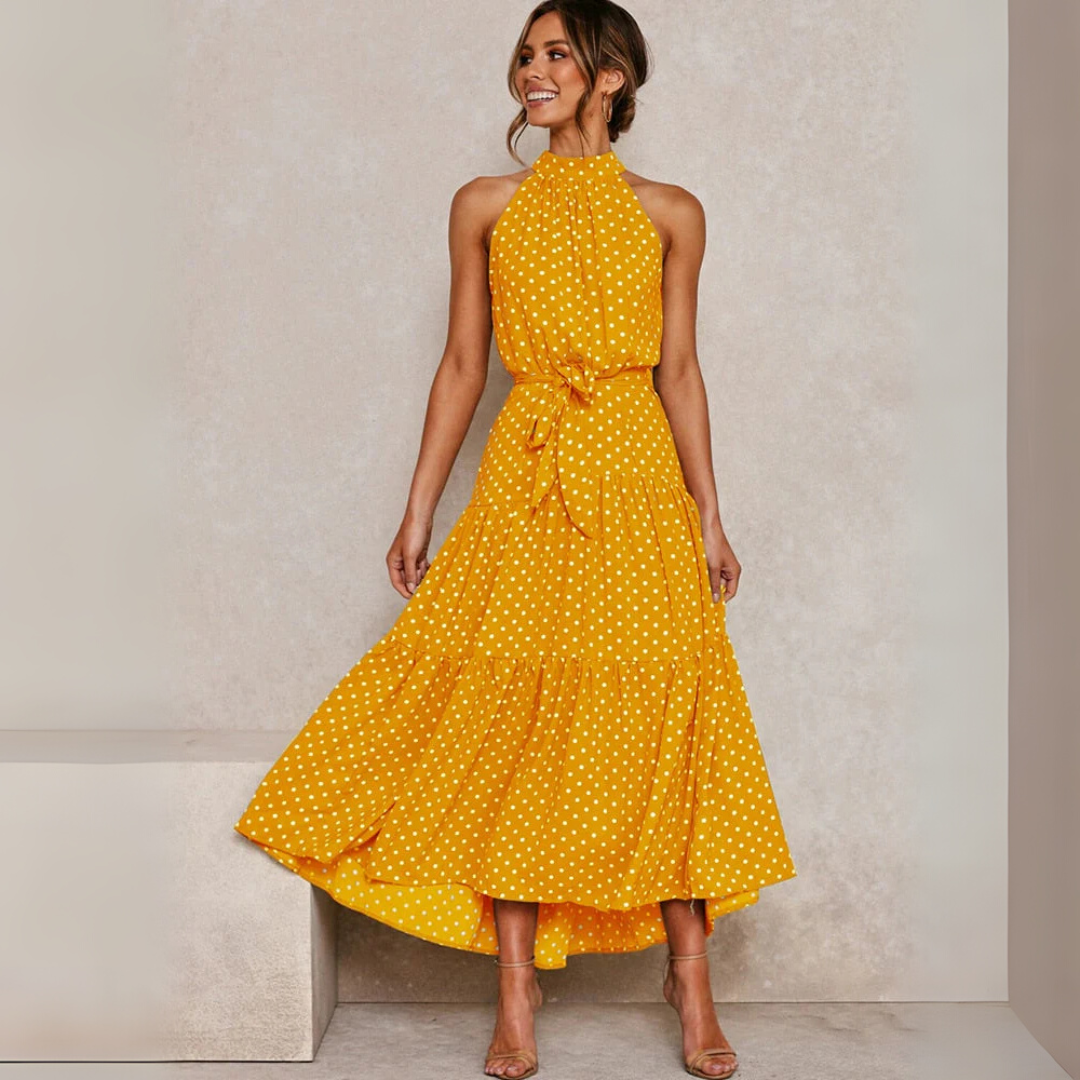 Dames midi-jurk met stippenprint en flatterende A-lijn pasvorm, perfect voor de zomer.