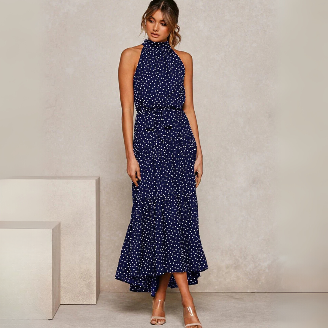 Flatterende A-lijn dames midi-jurk met vrolijke stippenprint, creëert een elegante en stijlvolle zomerlook.