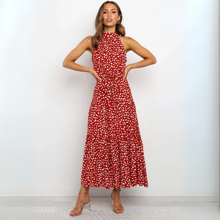 Polyester dames midi-jurk met stippenprint, mouwloos, casual en elegant te combineren.