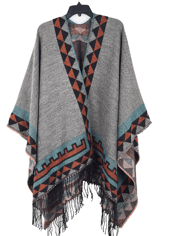 Warme dames poncho Kiki, een stijlvol najaars/winter accessoire. Comfortabele loose fit kleding in one size.