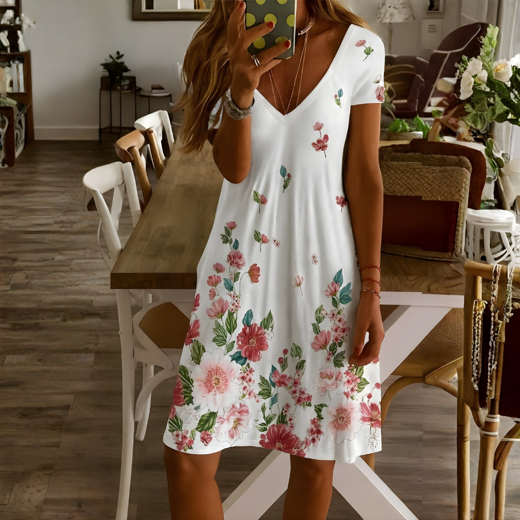 Veelzijdige plus size dames zomerjurk met kleurrijke mandala bloemenprint en korte mouwen.