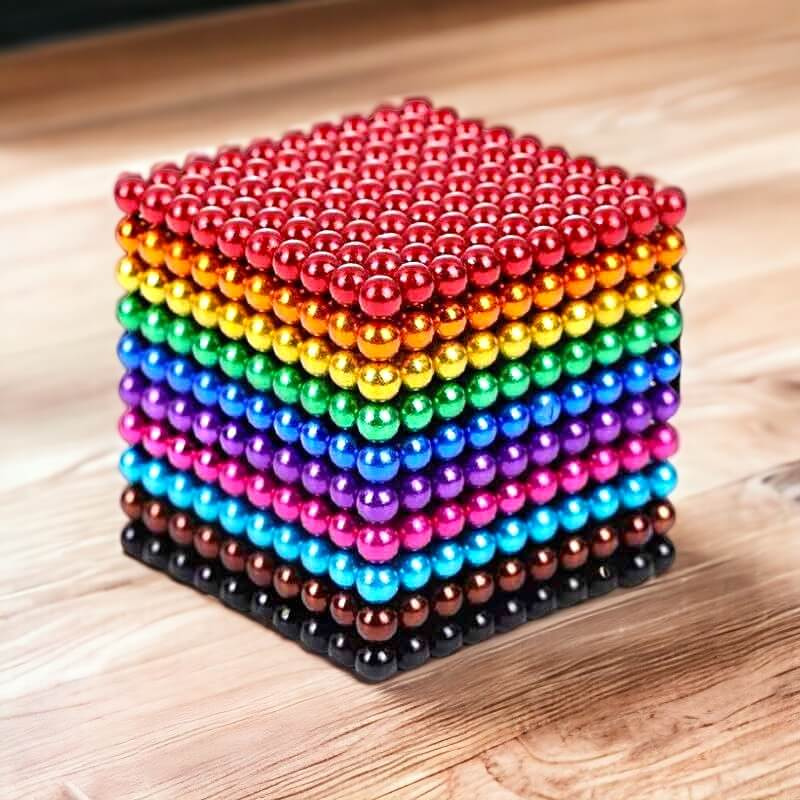 Kinderen bouwen figuren met diverse kleuren magnetische ballen. Creatief speelgoed voor stressvermindering en ontspanning.