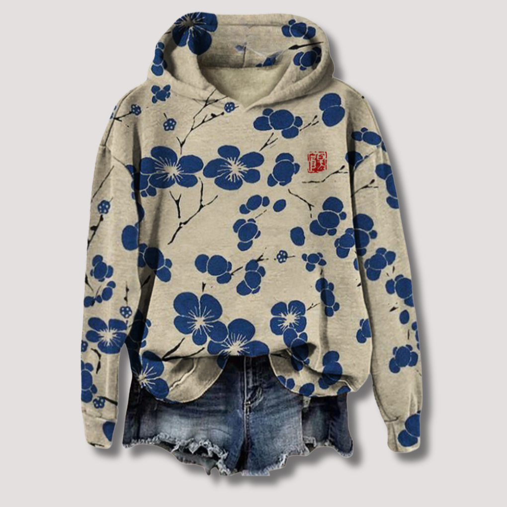 Trendy dames zomerhoodie met ademende stof en vrolijke bloemenprint. Comfortabele lichtgewicht trui met capuchon.