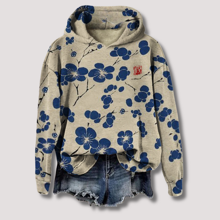 Trendy dames zomerhoodie met ademende stof en vrolijke bloemenprint. Comfortabele lichtgewicht trui met capuchon.