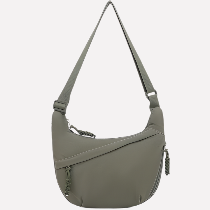 Trendy halvemaanvormige schoudertas voor vrouwen. Casual nylon tas met verstelbare band voor comfort.