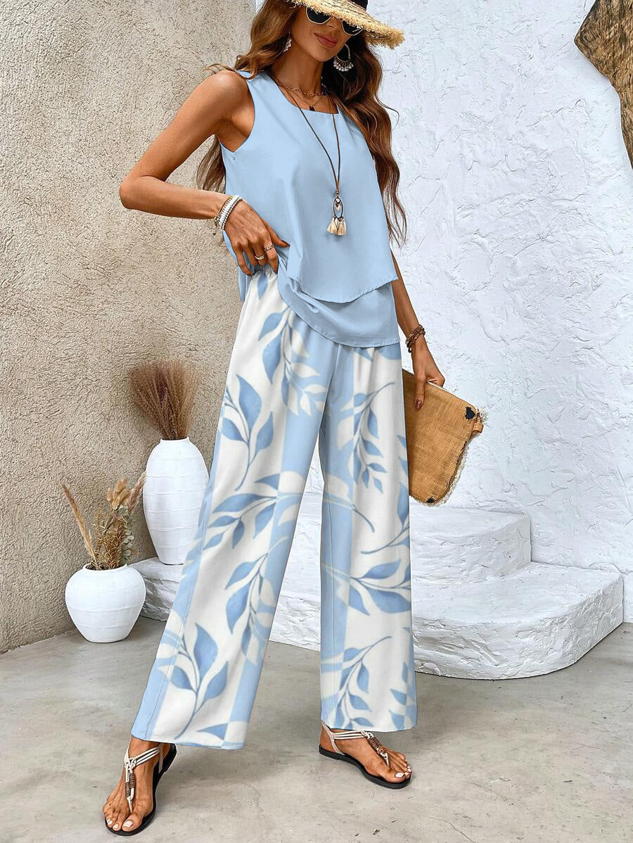 Stijlvolle en comfortabele dames zomer set voor warm weer, bestaande uit een chique top en losse broek.