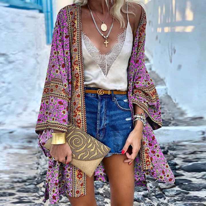 Trendy dames boho kimono vest, luchtig midi model met vrolijke print; een must-have voor zomerse dameskleding.