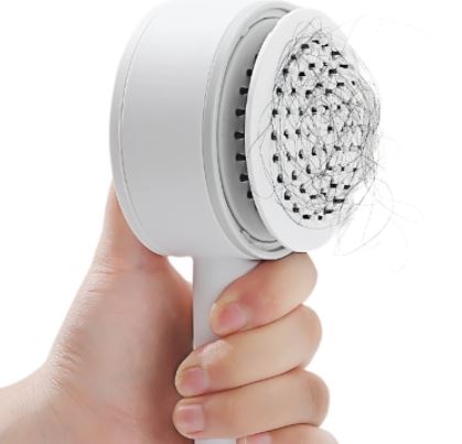 Detail van de zelfreinigende haarborstel die haren eenvoudig verwijdert; perfecte hygiëne voor elke dag.