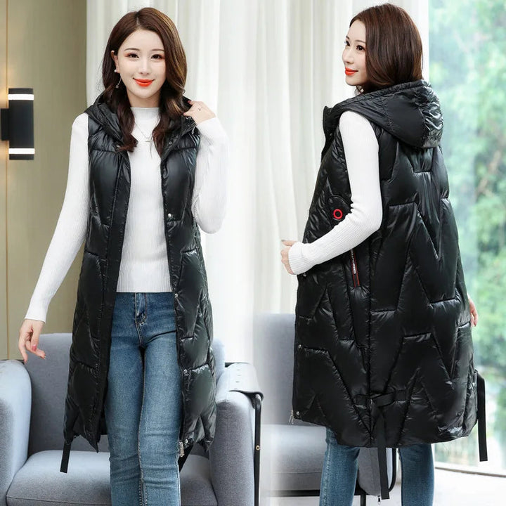 Warme puffer bodywarmer voor dames, lange effen winterjas model, ideaal voor koude dagen.
