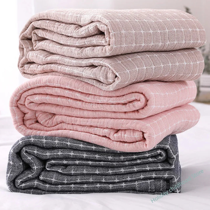 Gezellige, zachte katoenen woondeken op bank. Ademend BreezyCotton plaid, lichtgewicht en ideaal als sprei.