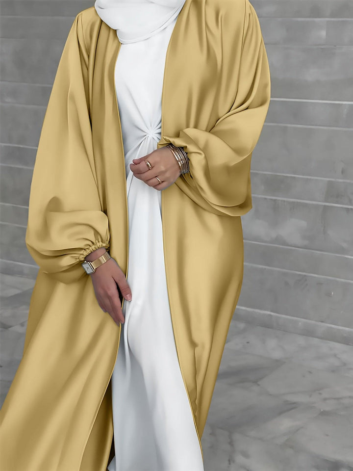 Tijdloze modest fashion abaya jurk met riem. Lange damesjurk voor een stijlvolle islamitische look.