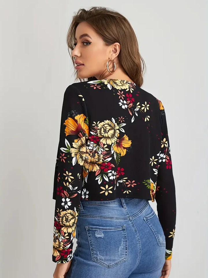Stijlvolle dames blazer met bloemenprint en open voorkant, perfect voor kantoor of casual lente looks.