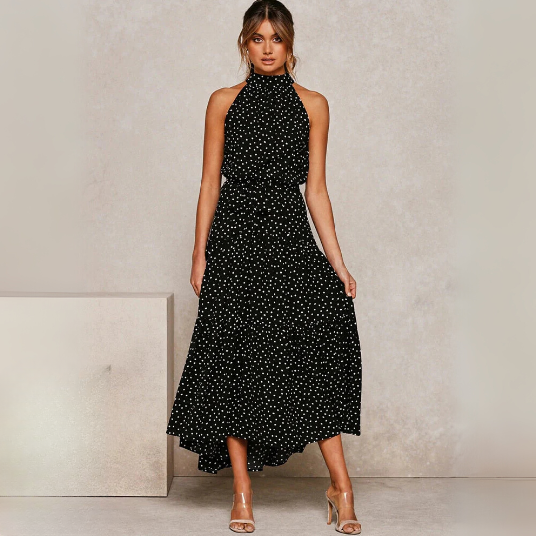 Zomerse dames midi-jurk met stippenprint in boho stijl, luchtig en comfortabel voor strand of stad.