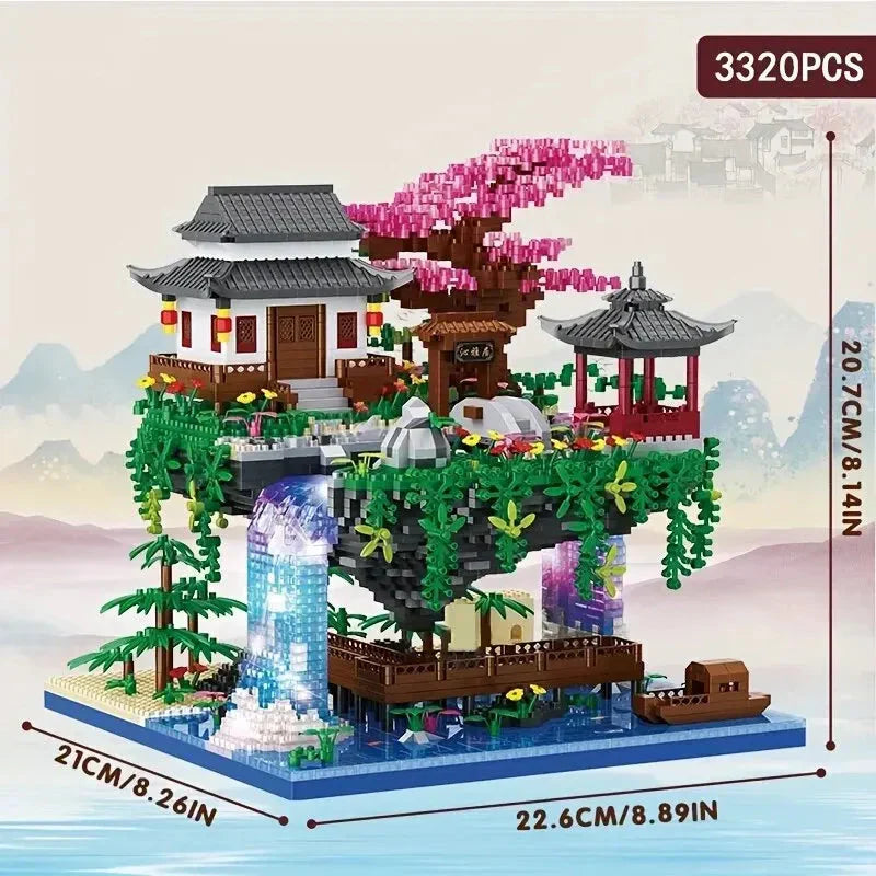 Glimmende diamant blokken vormen deze unieke boomhut bouwset met roze kersenbloesem & waterval lichteffect.