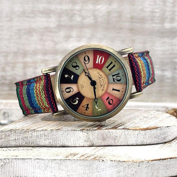 Stijlvol dames polshorloge met kleurrijk regenboogpatroon en trendy gevlochten PU leren band.