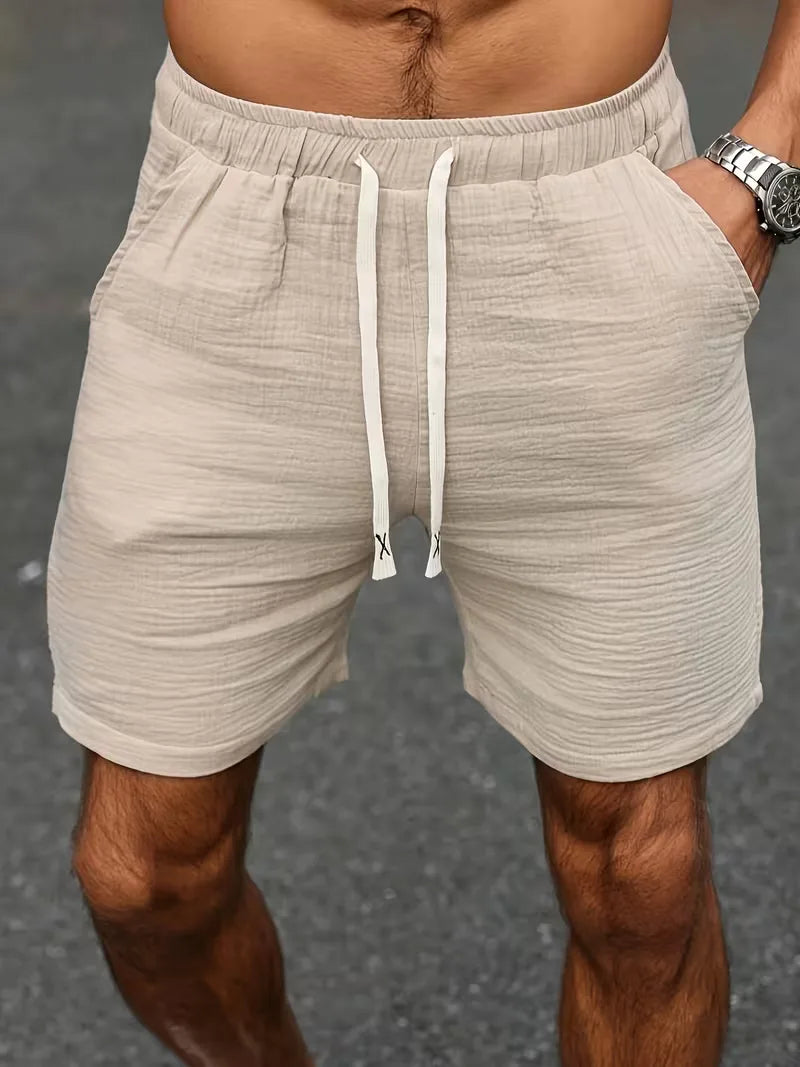 Moderne heren shorts, beige met elastische taille, een comfortabele en casual keuze voor zomerse dagen.