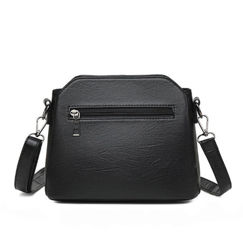 Stijlvolle paarse PU leren crossbody tas voor dames, praktisch en compact voor dagelijks gebruik.
