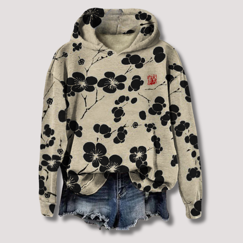 Lichtgewicht dames trui met trendy bloemenprint en comfortabele capuchon, ideaal voor lente/zomer. Ontspannen pasvorm.