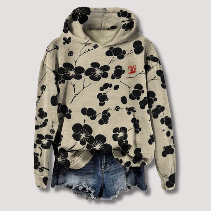 Lichtgewicht dames trui met trendy bloemenprint en comfortabele capuchon, ideaal voor lente/zomer. Ontspannen pasvorm.