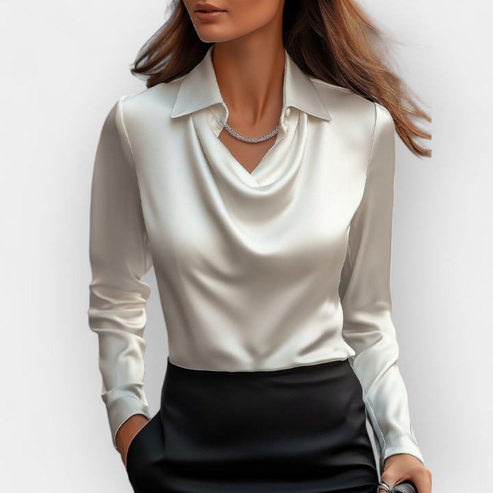 Elegante damesblouse met watervalkraag en lange mouwen. Perfect voor zakelijke of casual chic outfits.