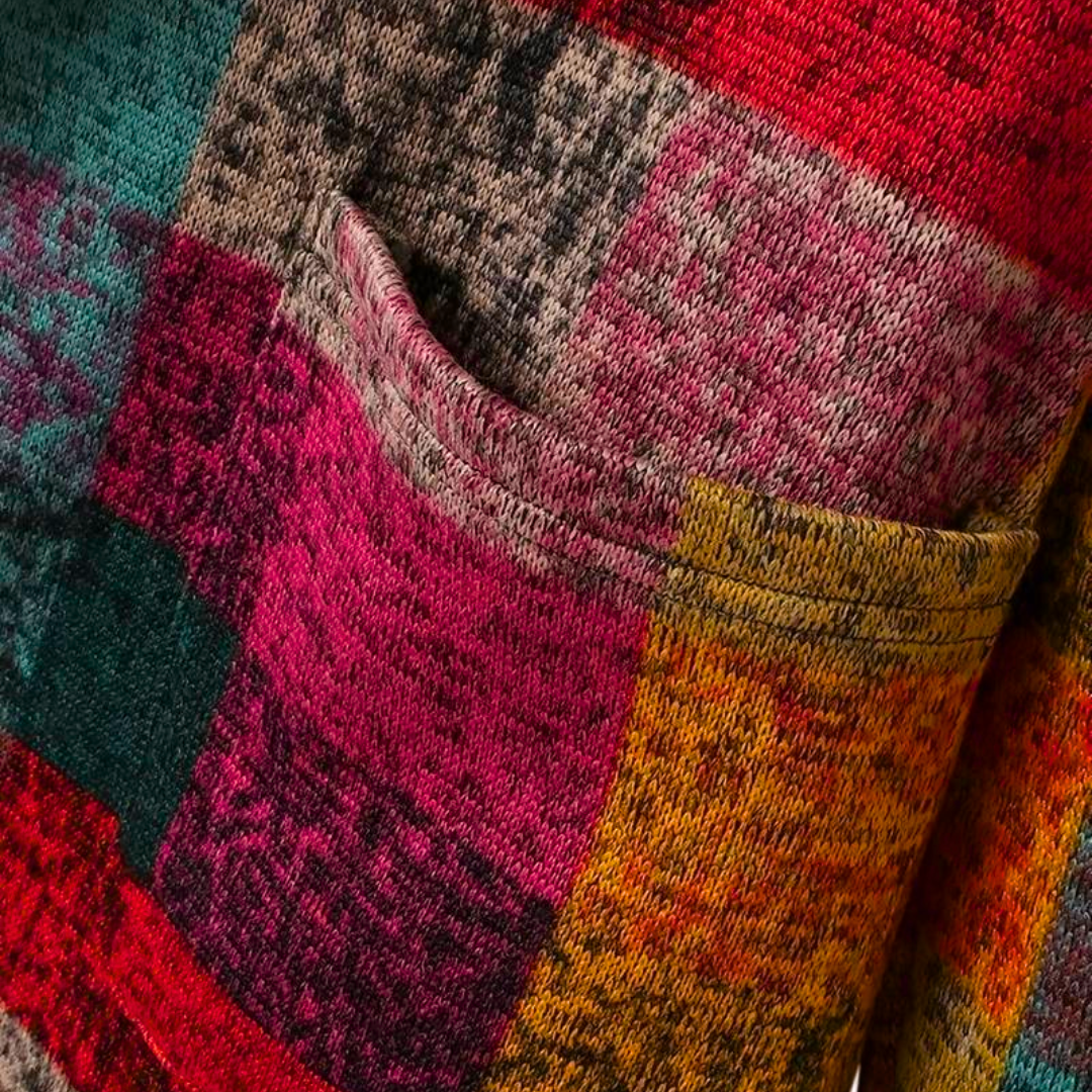 Modieus damesvest met capuchon en vrolijke colorblock print. Trendy herfst/winter kleding.