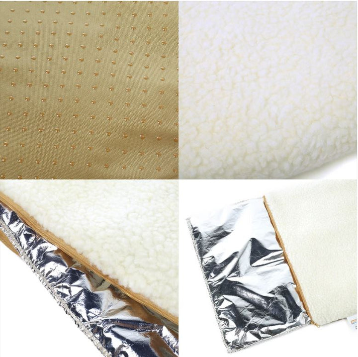 Hond ligt heerlijk warm in een zelfverwarmend huisdierbed, comfortabel en veilig met antislip.