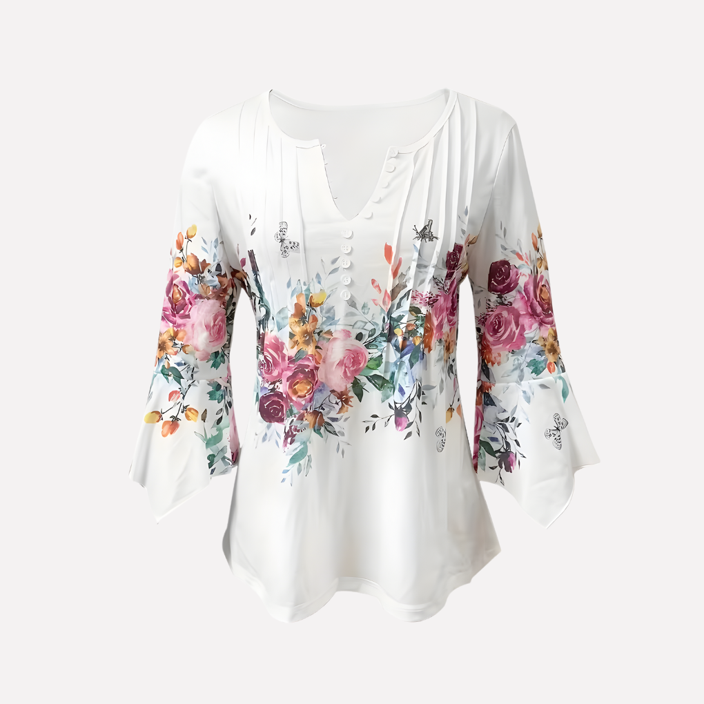Witte damesbloes met bloemenprint, V-hals en korte mouwen. Comfortabele, relaxte pasvorm voor zomerse casual elegantie.